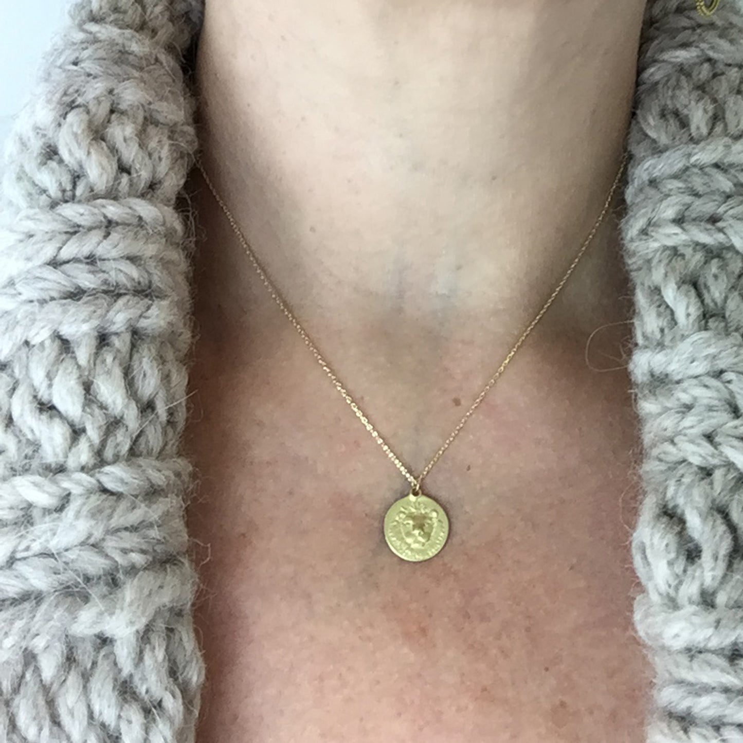 Leo Medal on neck