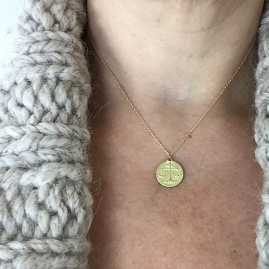 Libra Medal on neck