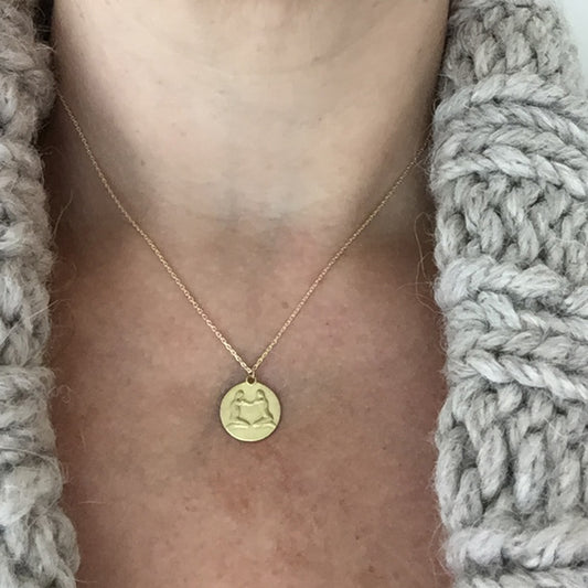 Gemini Medal on neck