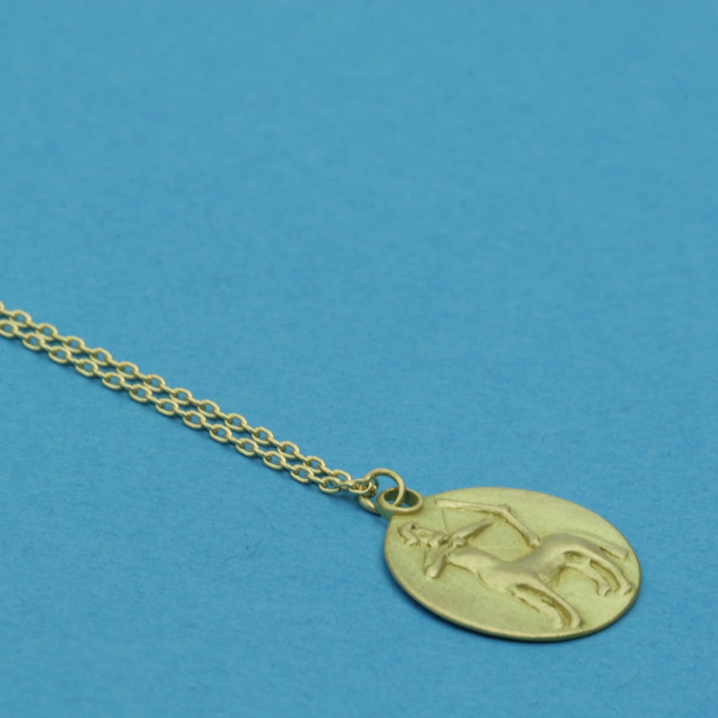 Sagittarius Medal on cable chain, side view