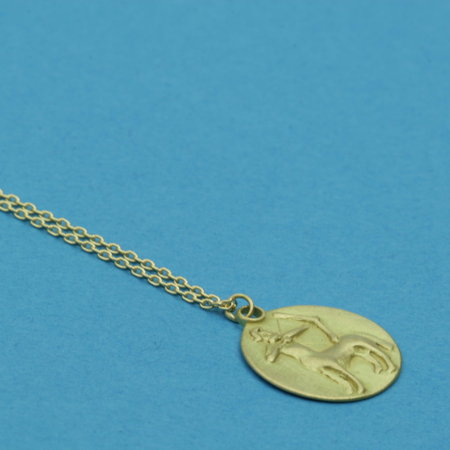 Sagittarius Medal on cable chain, side view